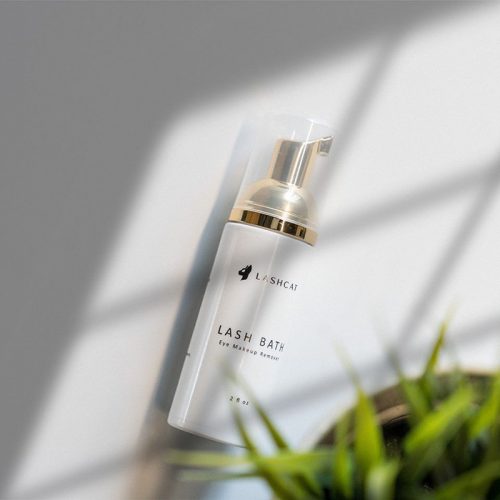 a bottle of make up is shown with the lashcat logo